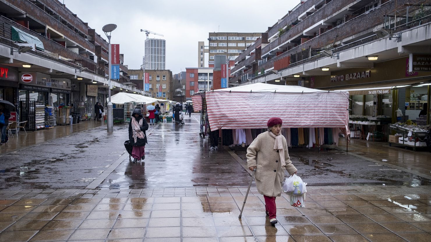 People pictured in the market area on Watney Street in Shadwell, London on March 8, 2023.