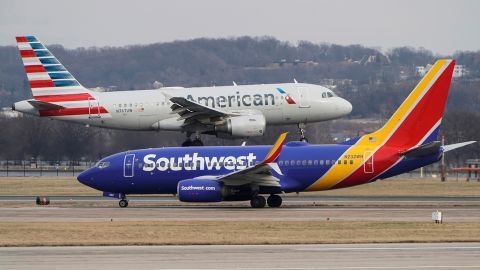 A Southwest Airlines aircraft taxis as an American Airlines aircraft lands at Reagan National Airport in Arlington, Virginia, in a January 2022 file photo.
