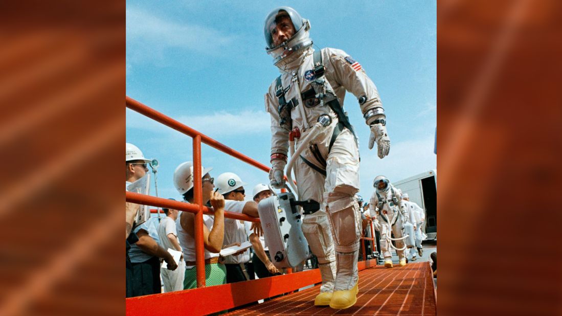Astronauts John W. Young (in front), command pilot, and Michael Collins, pilot, walk up the ramp at Pad 19 after arriving from the Launch Complex 16 suiting trailer during the prelaunch countdown for the Gemini-10 mission. Moments later, they entered the elevator that took them to the white room, where they could board the waiting spacecraft. Liftoff occurred at 5:20 p.m. ET on July 18, 1966.