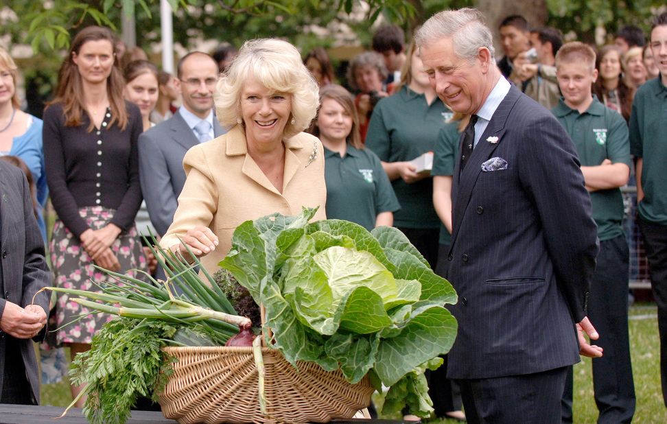Charles and Camilla are presented with vegetables as they visit the Dig for Victory organic allotment in London in July 2008. Camilla was celebrating her 61st birthday. 