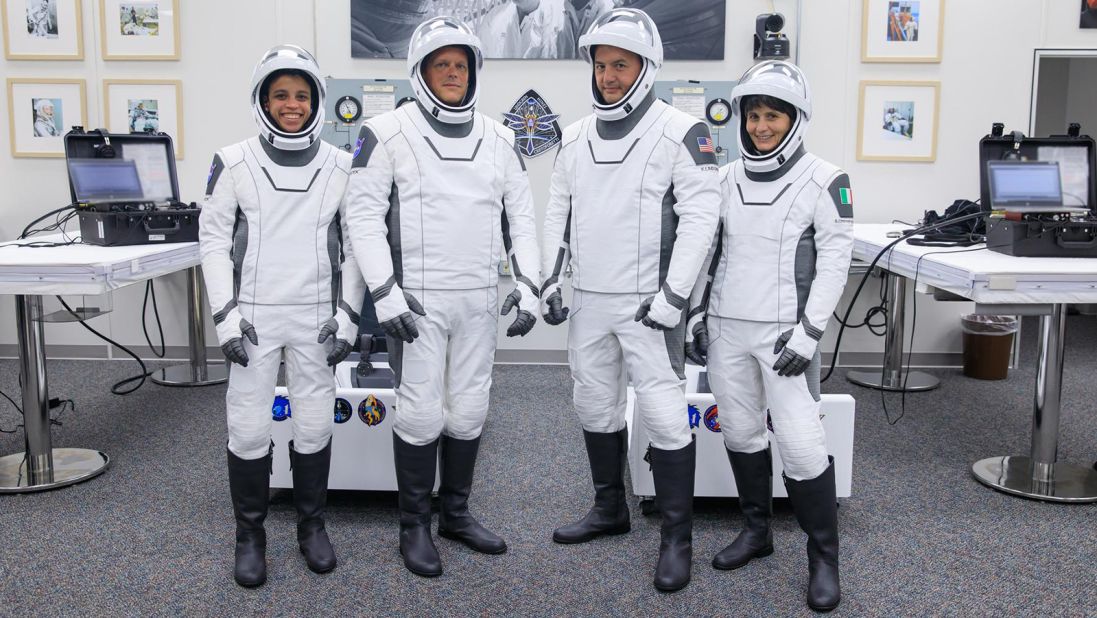 Astronauts participate in NASA's SpaceX Crew-4 dry dress rehearsal in the suit room inside Kennedy Space Center's Neil A. Armstrong Operations and Checkout Building on April 20, 2022. A team of SpaceX suit technicians assisted crew members as they put on their custom-fitted spacesuits and checked the suits for leaks. Pictured, from left, are Jessica Watkins, mission specialist; Bob Hines, pilot; Kjell Lindgren, commander; and Samantha Cristoforetti, mission specialist. 