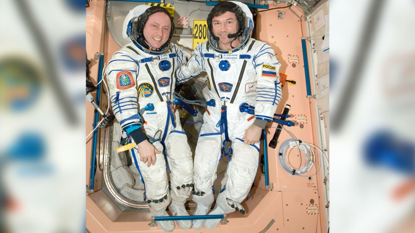 NASA astronaut Michael Fincke (left), Expedition 18 commander; and cosmonaut Yury Lonchakov, flight engineer, attired in Russian Sokol flight suits, pose in the Unity node of the International Space Station in this photo from March 26, 2009.