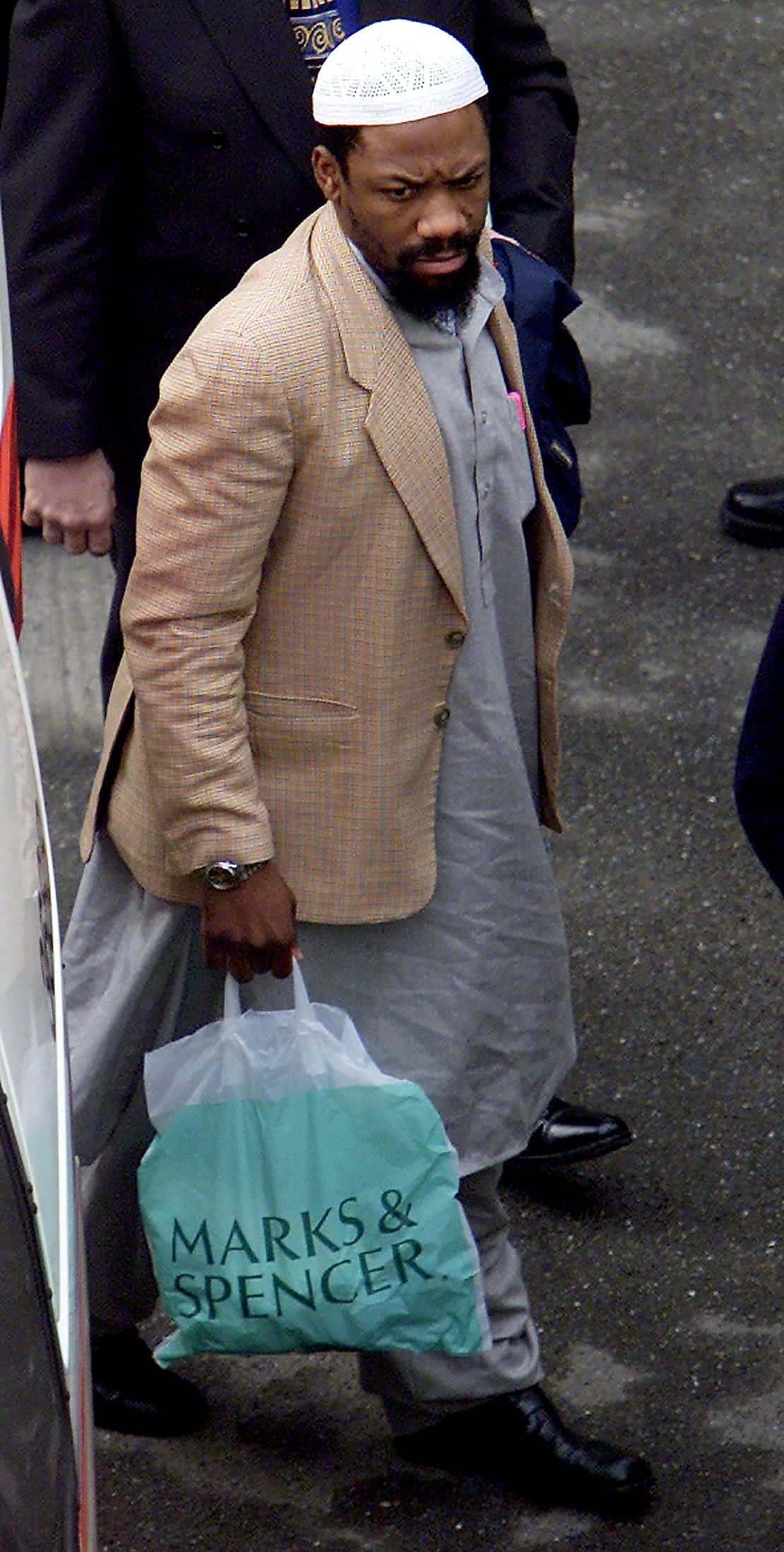 Abdullah el-Faisal arrives at Bow Sreet Magistrates Court in
London in February 2002. 