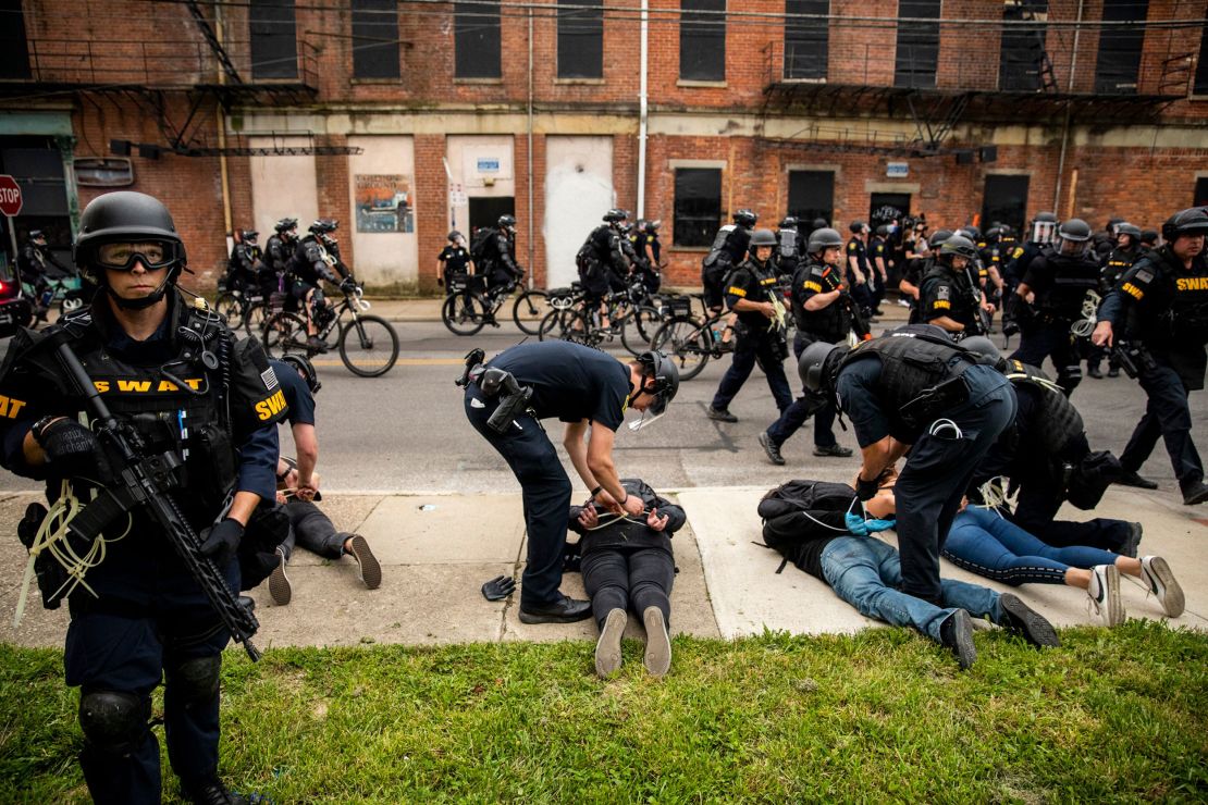 Cincinnati police officers arrest protesters after curfew in June 2020. The protests were in response to the death of George Floyd in Minneapolis.