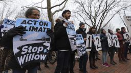 WASHINGTON D.C., UNITED STATES - JANUARY 10: Climate activists gather to protest with demanding President Biden stop the Willow Project by unfurling a banner on the Lafayette Square in front of the White House on January 10, 2023 in Washington D.C., United States. (Photo by Celal Gunes/Anadolu Agency via Getty Images)