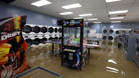 Floodwaters fill the Pajaro Coin Laundry on March 14, 2023 in Pajaro, California.