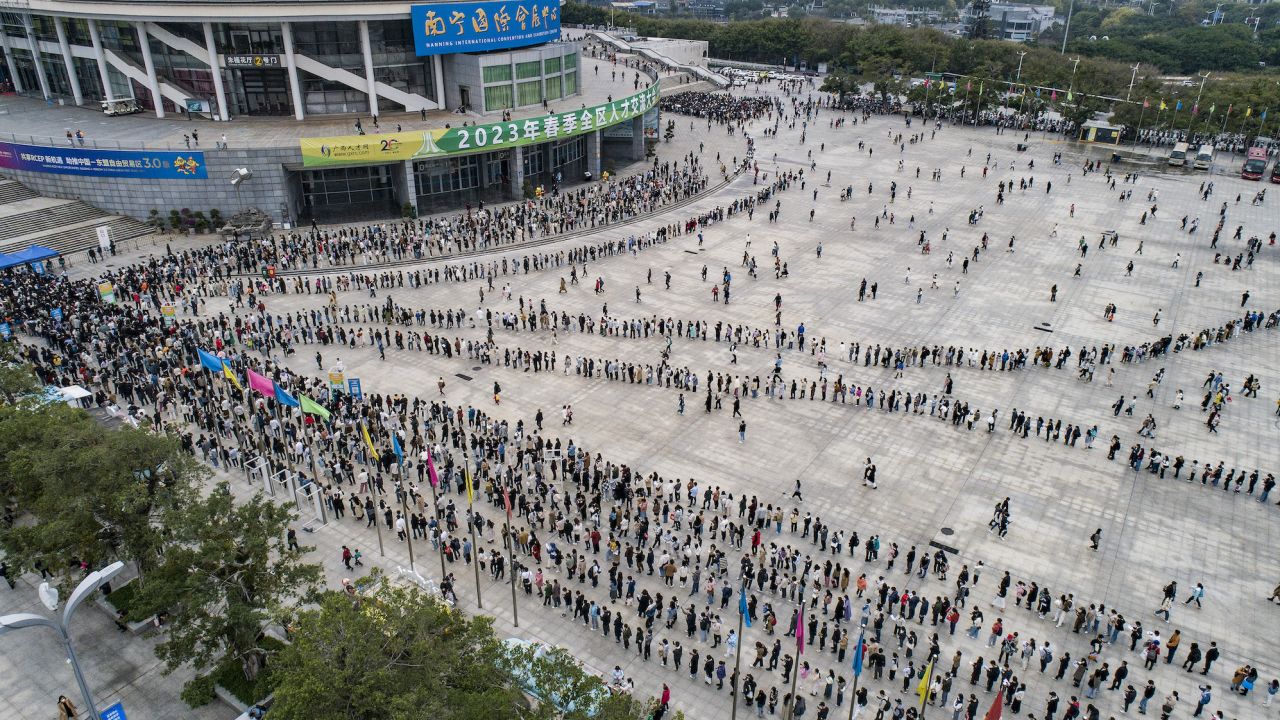 A large number of employment seekers line up outside a job fair in Nanning, Guangxi province on February 18, 2023.
