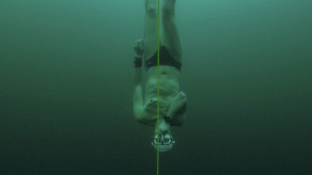 David Vencl: Free-diver plunges to record depth beneath frozen Swiss lake |  CNN