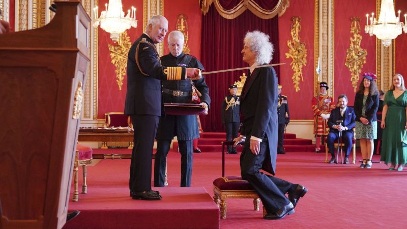 Brian May, lead guitarist of rock band Queen, receives knighthood from King Charles III | CNN