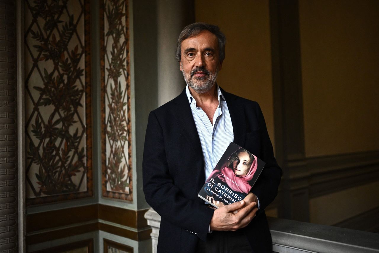 Carlo Vecce holds a copy of his book "Il Sorriso di  Caterina" ("Caterina's Smile") in Villa La Loggia in Florence, Italy on March 14, 2023. 