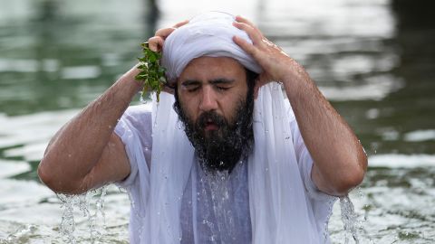 A member of Iraq's Sabean-Mandaean community takes part in a ritual celebrating the five-day Eid al-Khaliqah religious holiday on the banks of the Shatt al-Arab waterway in the southern city of Basra, Iraq on Tuesday. 