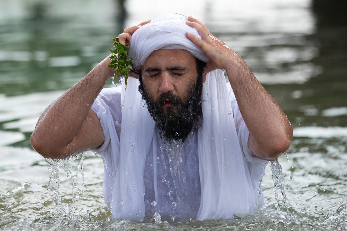 A member of Iraq's Sabean-Mandaean community takes part in a ritual celebrating the five-day Eid al-Khaliqah religious holiday on the banks of the Shatt al-Arab waterway in the southern city of Basra, Iraq on Tuesday. 