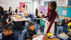 Aisha Thomas (purple shirt) is learning teaching skills with the teacher Alexxa Martinez, in her classroom in Nevitt Elementary School, in Phoenix, Arizona, on October 26, 2022. (Photo by Olivier TOURON / AFP)