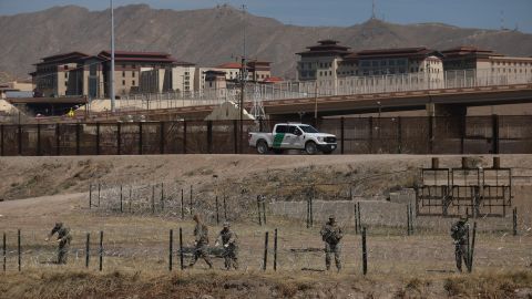 National Guard agents place a barbed wire wall on the banks of the Rio Grande in El Paso, Texas, on the border with Ciudad Juarez, Chihuahua State, Mexico, on March 8, 2023.
