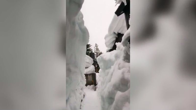 Man builds 12-foot-tall snow tunnel to get out of home | CNN