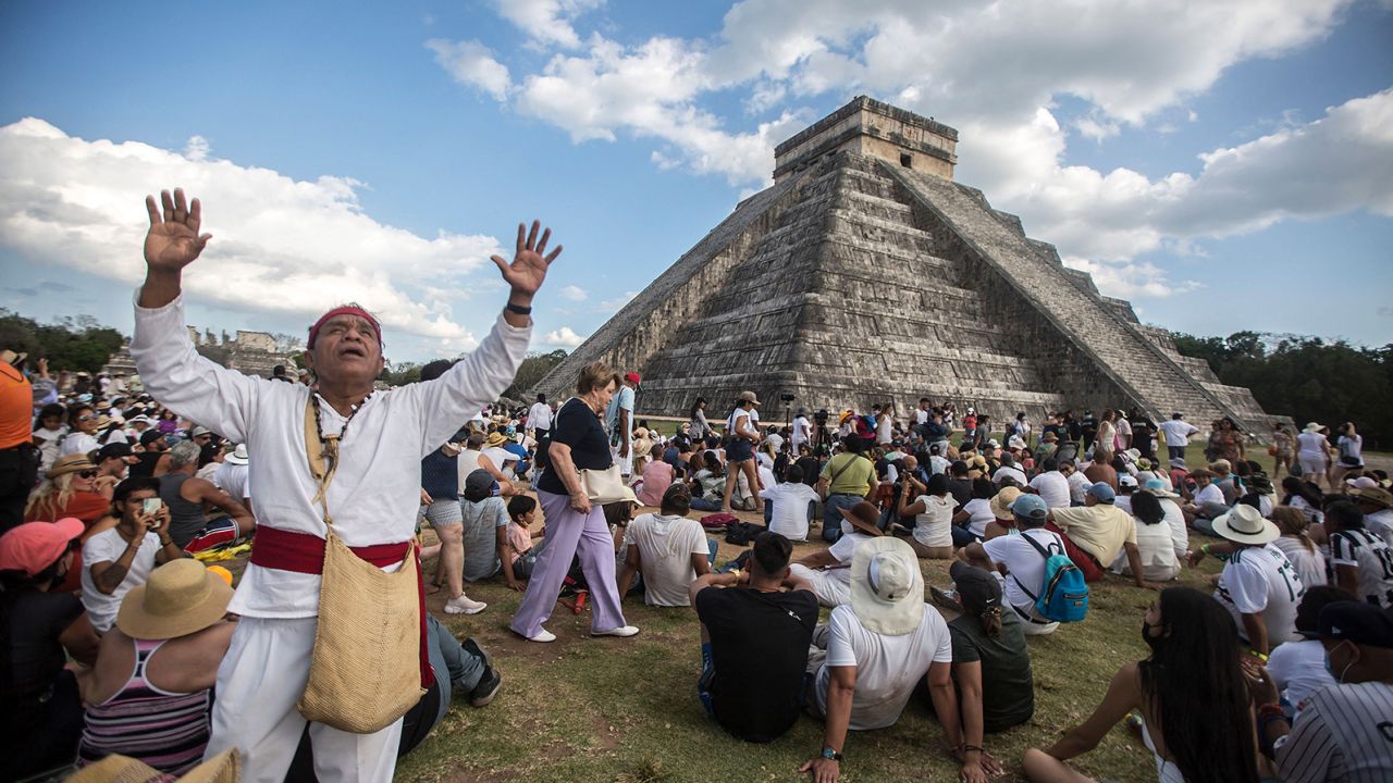 People surround the Kukulcán Pyramid at the Mayan archaeological site of Chichen Itza in Mexico during the celebration of the 2022 spring equinox.