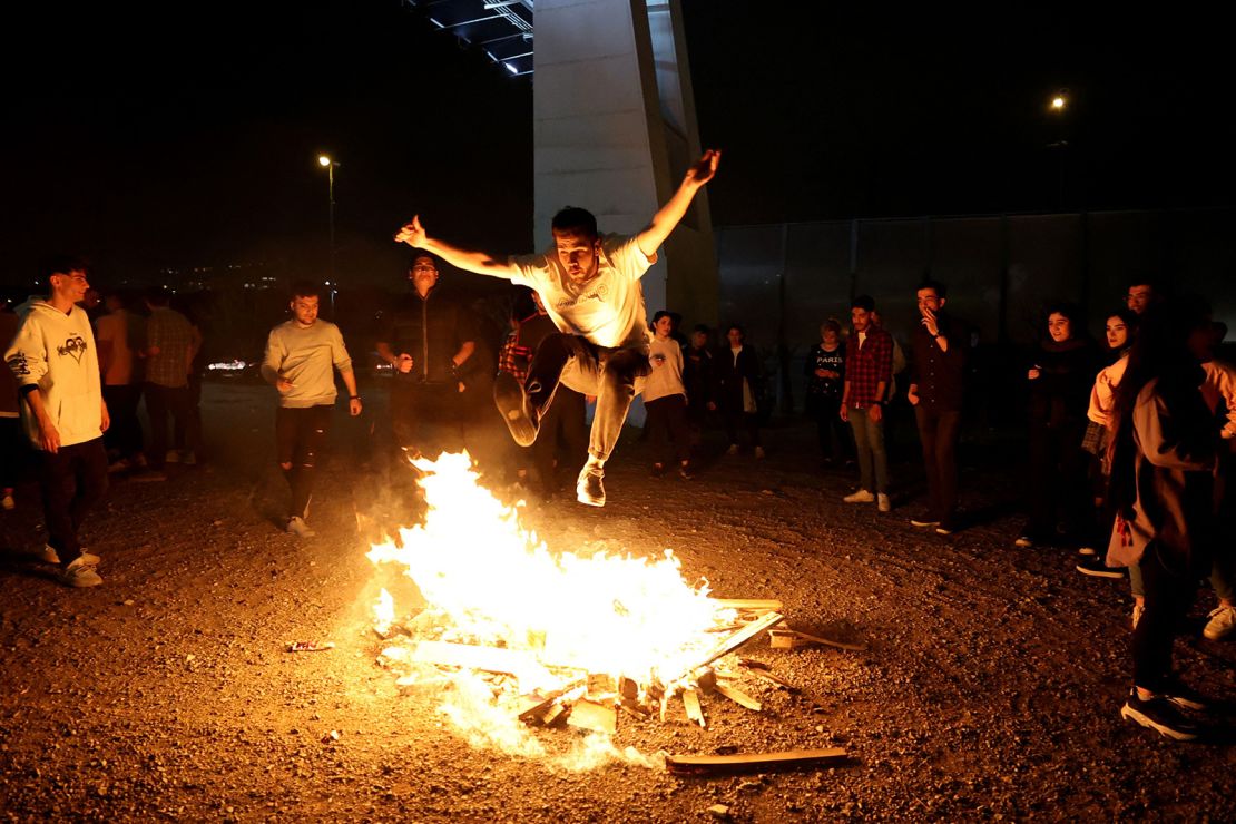 In Tehran, an Iranian jumps over a bonfire during the ancient festival of fire, or Chaharshanbeh Soori, held annually on the last Wednesday eve before Nowruz.