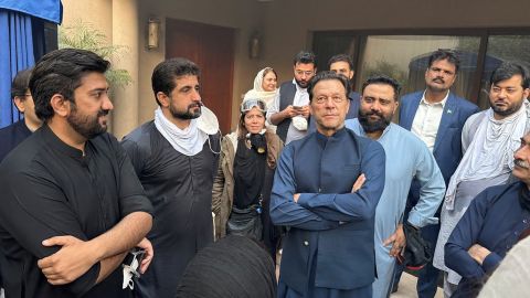 Imran Khan greets supporters outside his residence in Lahore on Wednesday.