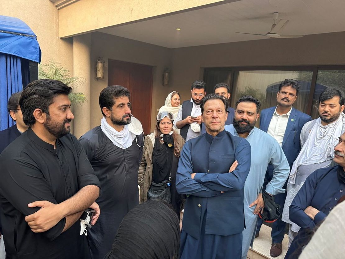 Imran Khan greets supporters outside his residence in Lahore on Wednesday.