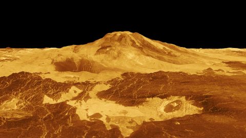 A computer-generated 3D image of Maat Mons depicts how volcanoes and lava flows extend hundreds of kilometers across a fractured plain.