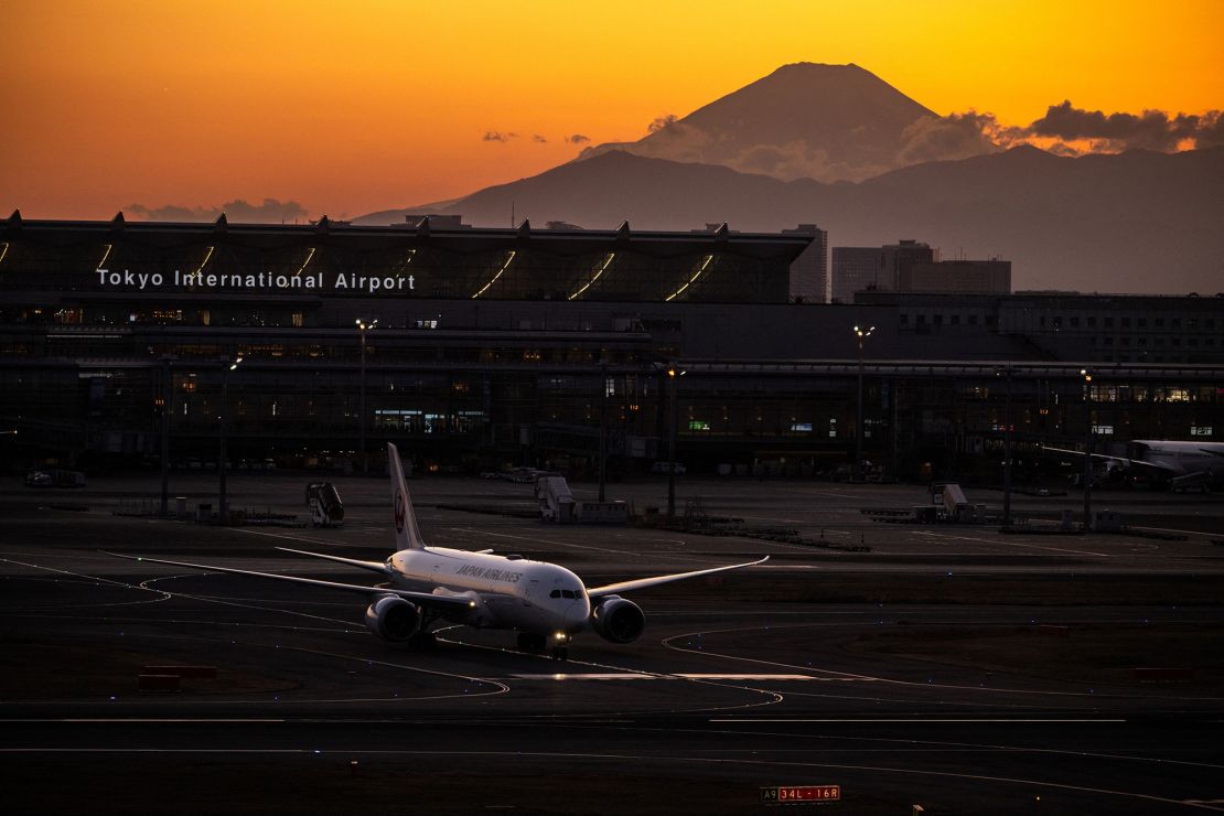 A Japan Airlines plane, pictured with Mount Fuji in the background at Haneda Airport in Tokyo in February.
