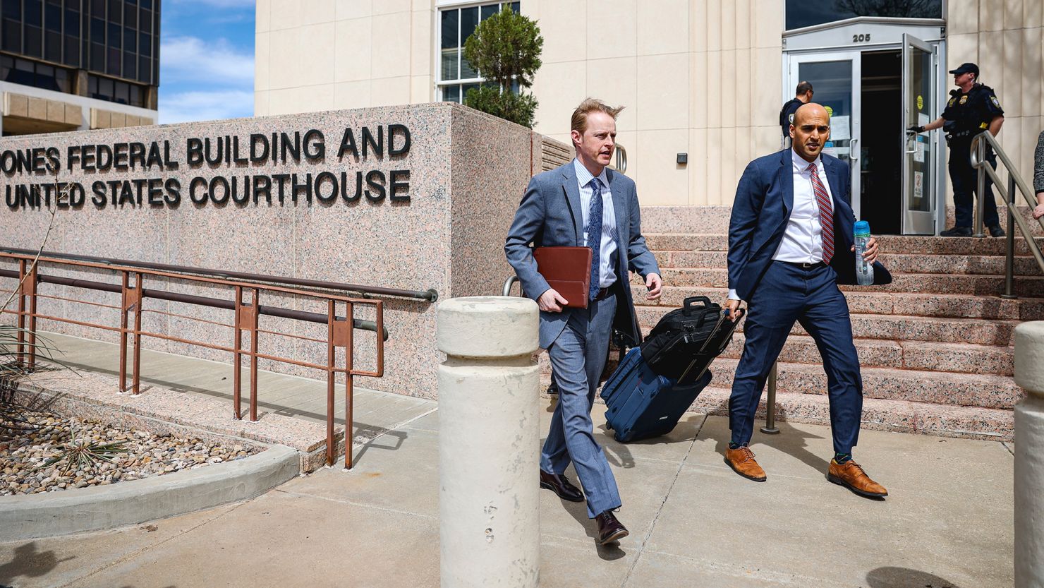 Erik Baptist, right, and other legal team members with Alliance Defending Freedom exit the federal court building on March 15, 2023, in Amarillo, Texas.