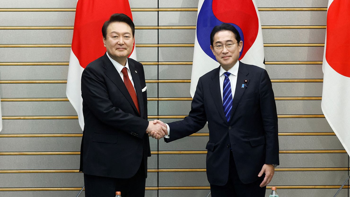 South Korea's President Yoon Suk Yeol shakes hands with Japan's Prime Minister Fumio Kishida, as the meet at the prime minister's official residence in Tokyo, Japan, March 16, 2023. Kiyoshi Ota/Pool via REUTERS