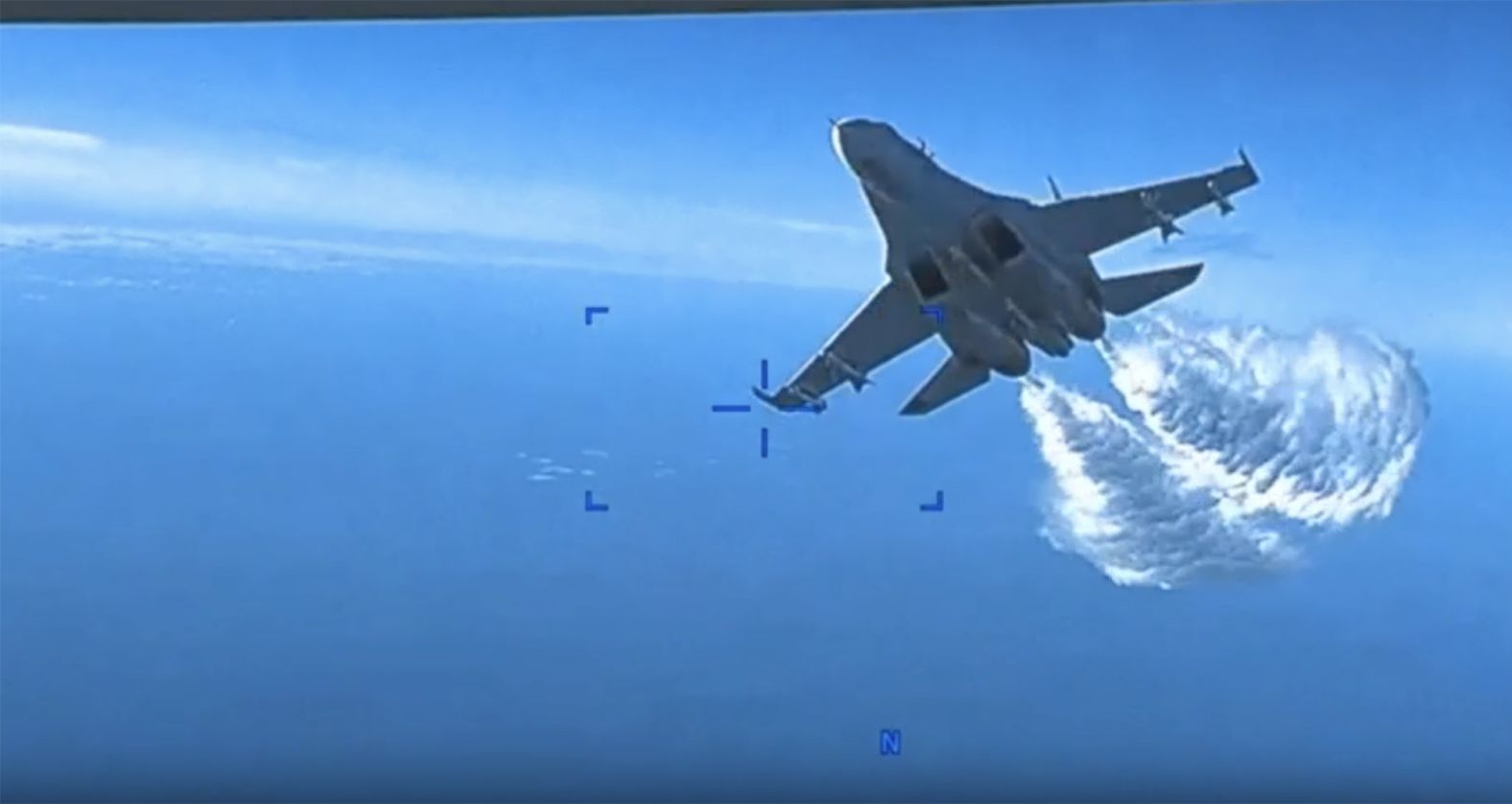 A still taken from video footage released by the US European Command shows an <a href="index.php?page=&url=https%3A%2F%2Fwww.cnn.com%2F2023%2F03%2F14%2Fpolitics%2Fus-drone-russian-jet-black-sea" target="_blank">encounter</a> between a US surveillance drone and Russian fighter jets over the Black Sea on Tuesday, March 14. The MQ-9 Reaper drone and two Russian Su-27 aircraft were flying over international waters when one of the Russian jets intentionally flew in front of and dumped fuel on the unmanned drone several times, a statement from US European Command said. The aircraft then hit the propeller of the drone, prompting US forces to bring the drone down in the Black Sea.