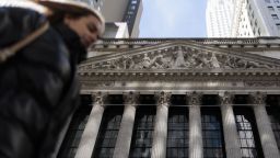 A person walks past the front of the New York Stock Exchange in New York, New York, USA, 15 March 2023. 