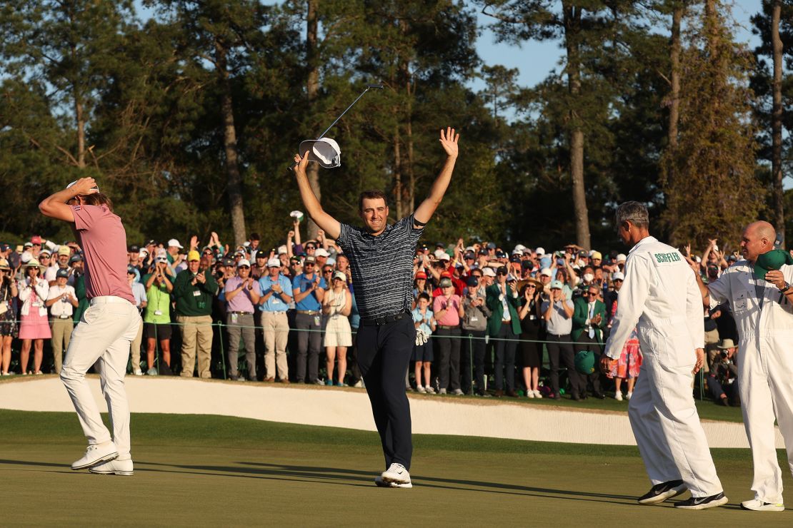 Scheffler celebrates on the 18th green after sealing victory at Augusta in 2022.