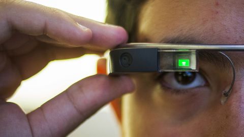 Tiago Amorim of Brazil, poses with a Google Glass eyewear frame in Manhattan, New York September 19, 2014.