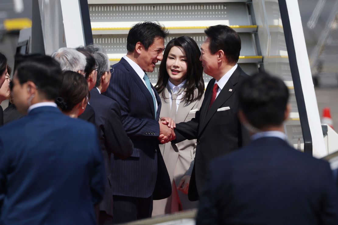South Korean President Yoon Suk Yeol arrive at Haneda International Airport with his wife Kim Keon-hee in Tokyo on March 16, 2023. 