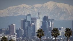 The snow-covered San Gabriel mountain range past the downtown Los Angeles skyline after a winter storm in Los Angeles, California, US, on Thursday, March 2, 2023. A sprawling winter storm last week put a substantial dent in California's historic water shortage with less than half of its land now in drought for the first time since 2020. Photographer: Eric Thayer/Bloomberg via Getty Images