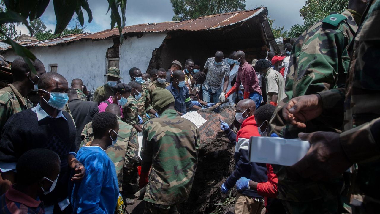 Malawi Defence Force soldiers recover a body of a victim of landslide at Manje informal settlement in Blantyre, southern Malawi, March 16, 2023.