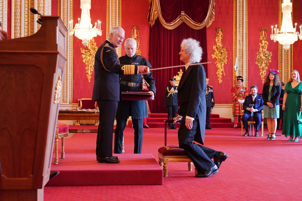 Rock Guitarist Brian May is made a Knight Bachelor by King Charles III at Buckingham Palace in London on Tuesday, March 14. The founding member of the band Queen will now be known as Sir Brian, following the investiture ceremony.