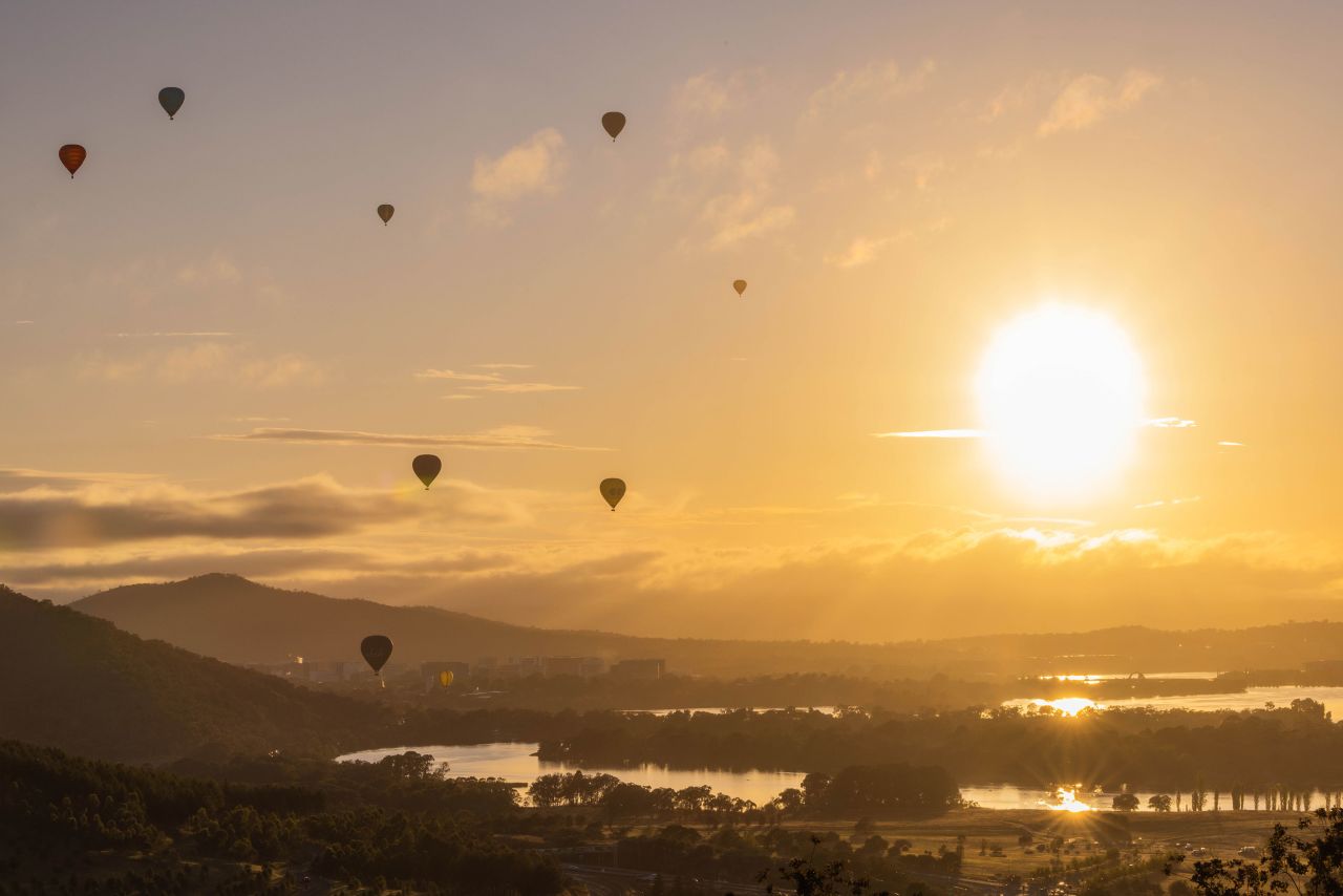 Hot air balloons soar during the annual Canberra Balloon Spectacular festival in Canberra, Australia, on Tuesday, March 14.