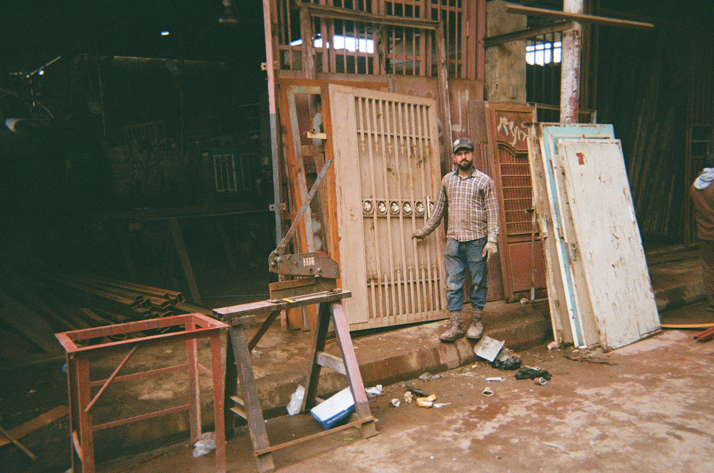 Blacksmith working at a market in Falluja.