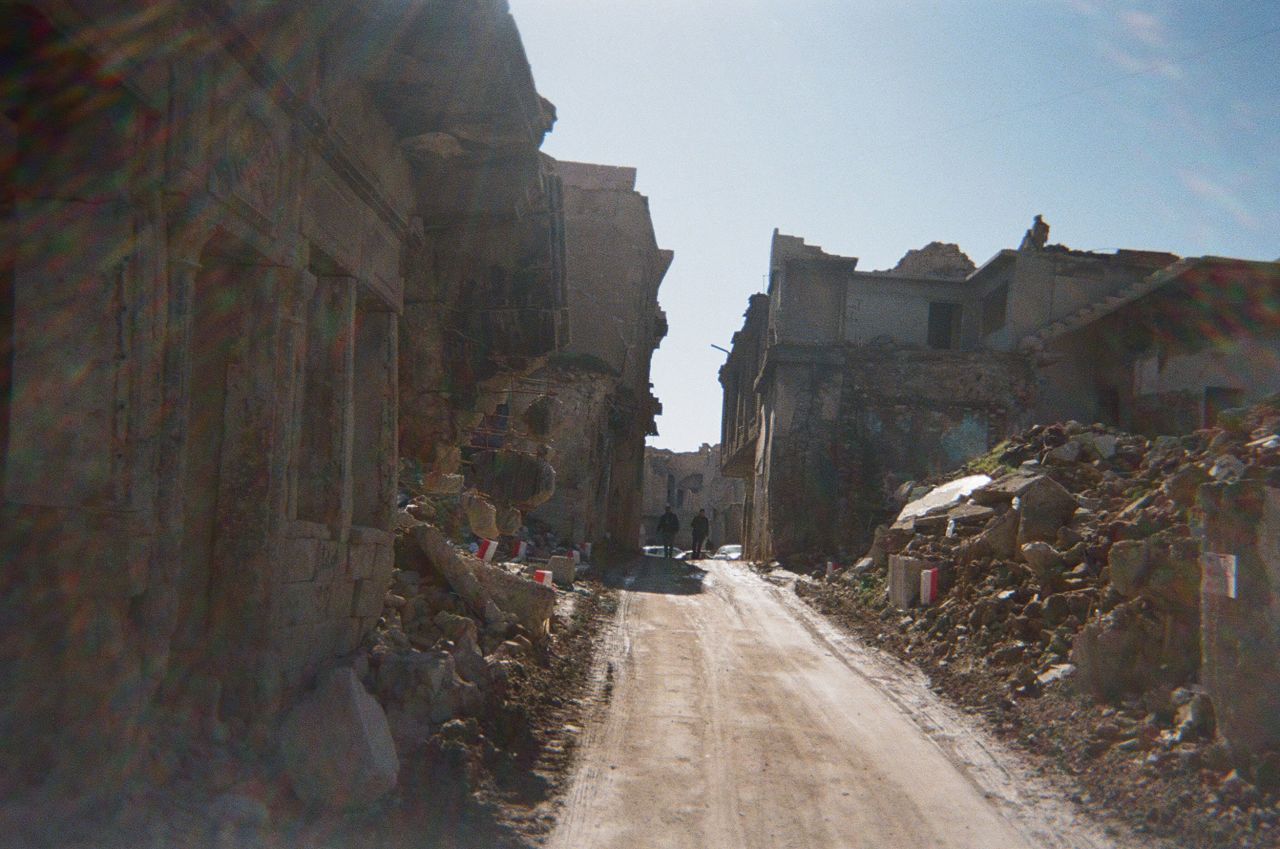 This used to be a busy commercial street for carpenters in the al-Maydan area of Mosul. It became the site of the <a href="http://www.cnn.com/2004/WORLD/meast/11/08/iraq.main/" target="_blank">last ISIS battle in the city</a>, which lasted from October 2016 until July 2017.<br /><br />"I had to drop out of school because of the bad conditions immediately after the 2017 war (against ISIS), and I had to work constantly," said 22-year-old Ahmed Faisal, a self-employed construction worker. "Also, despite improving my skills as a photographer, I could not find a job that helped me improve my skills."<br /><br />The past 20 years have brought instability to Faisal's family, he says. They were dispersed because of illness and a lack of job opportunities in the area. His father was forced to work multiple jobs in various skills to make ends meet.