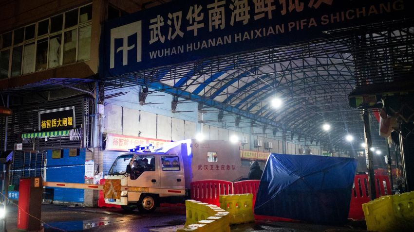 Members of staff of the Wuhan Hygiene Emergency Response Team drive their vehicle as they leave the closed Huanan Seafood Wholesale Market in the city of Wuhan, in Hubei, Province on January 11, 2020, where the Wuhan health commission said that the man who died from a respiratory illness had purchased goods. - China said on January 11, 2020 that a 61-year-old man had become the first person to die from a respiratory illness believed to be caused by a new virus from the same family as SARS (Sudden Acute Respiratory Syndrome), which claimed hundreds of lives more than a decade ago. Forty-one people with pneumonia-like symptoms have so far been diagnosed with the new virus in Wuhan, with one of the victims dying on January 8, 2020, the central Chinese city's health commission said on its website. (Photo by NOEL CELIS / AFP) (Photo by NOEL CELIS/AFP via Getty Images)