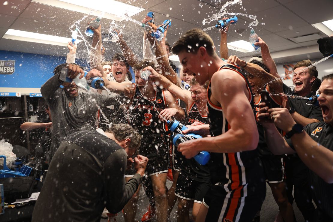 Princeton Tigers beat the Arizona Wildcats 59-55 and sprayed head coach Mitch Henderson with water after the win.