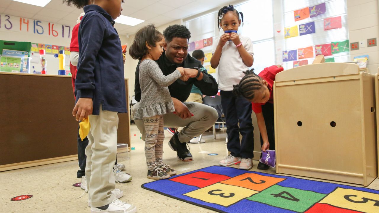 Johnathon Hines plays with his preschool students on March 13, 2023.