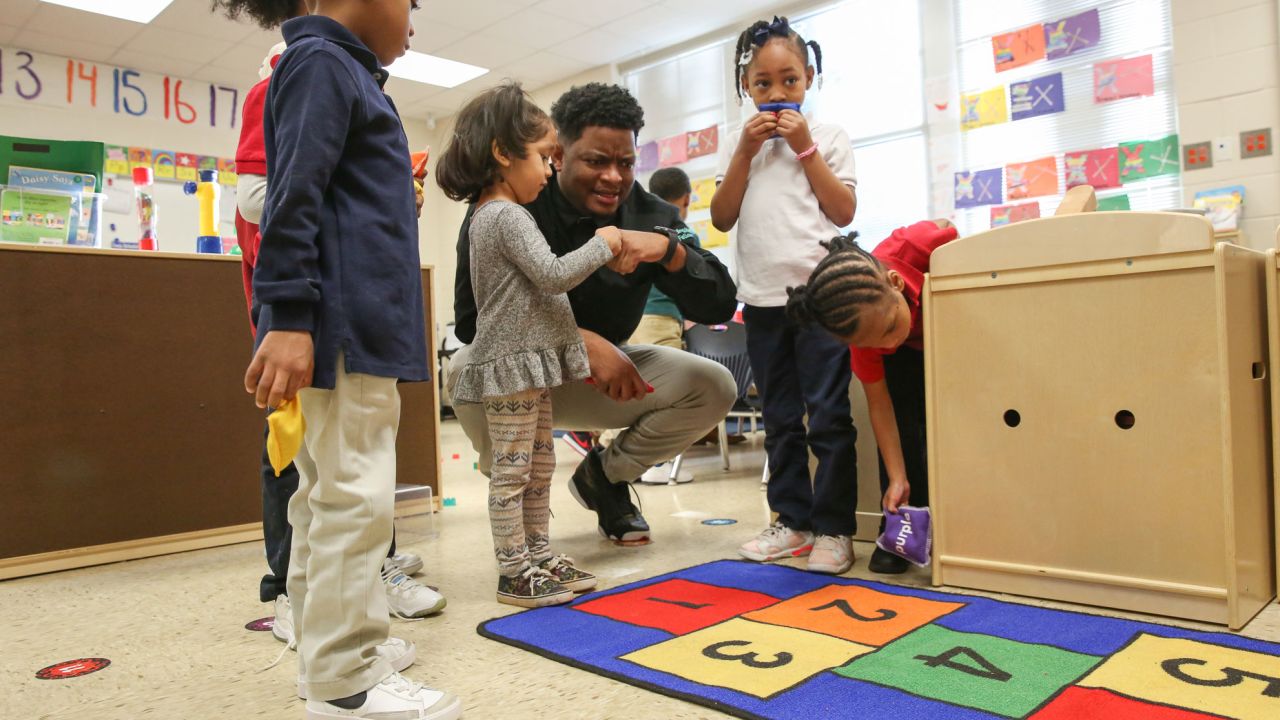 Johnathon Hines plays with his pre-K students on March 13, 2023.