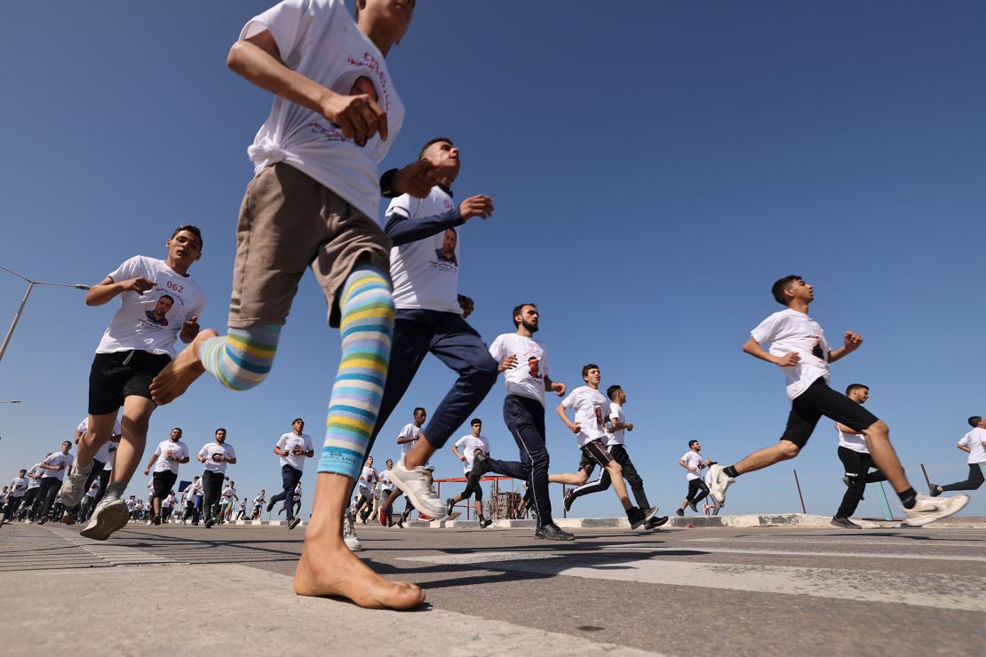 Palestinian runners take part in a marathon to denounce the killing of Palestinians by the Israeli army in the occupied West Bank and to support Palestinians in Israeli jails, in Gaza City on Friday.