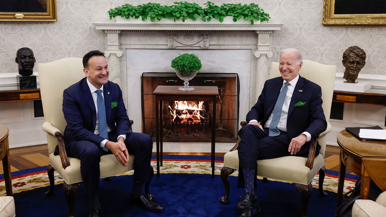 President Joe Biden and Irish Taoiseach Leo Varadkar speak to one another in the Oval Office of the White House on March 17, 2023 in Washington, DC.
