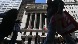 People walk past the New York Stock Exchange (NYSE) on March 16, 2023 in New York City.