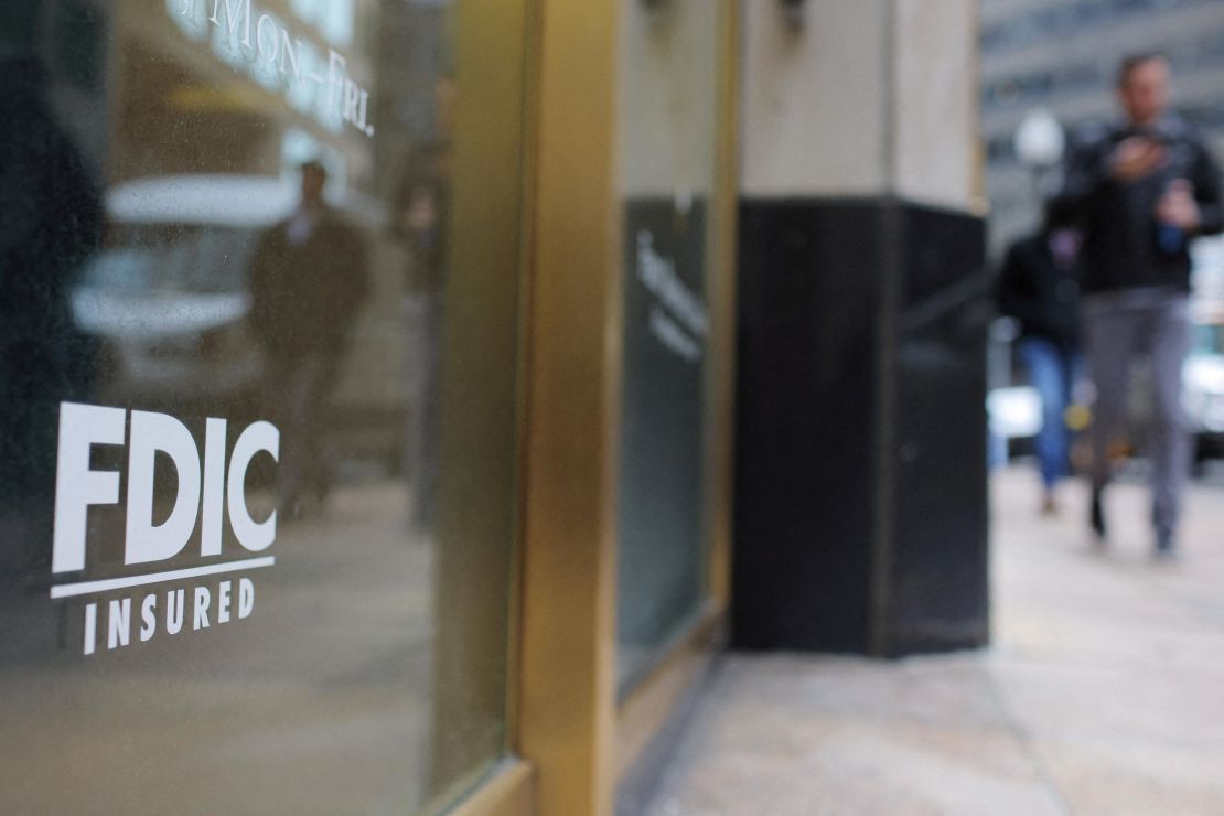 A sign reads "FDIC Insured" on the door of a branch of First Republic Bank in Boston, Massachusetts, U.S., March 13, 2023.
