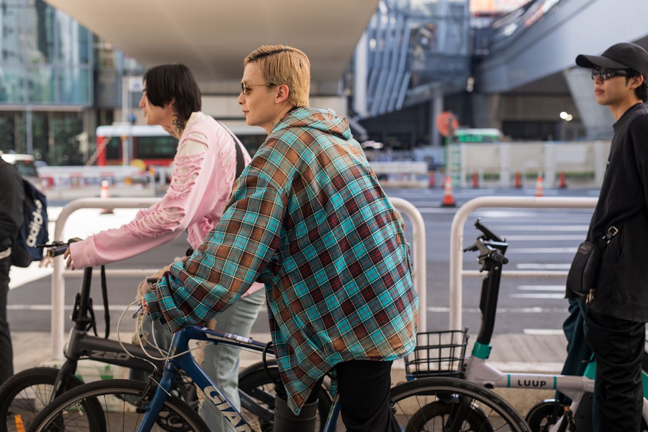 Yuki Tanaka told CNN "fashion is my reason for living." He said he wanted to wear his blue plaid jacket to complement his bike, which he rode to the shows on Thursday.