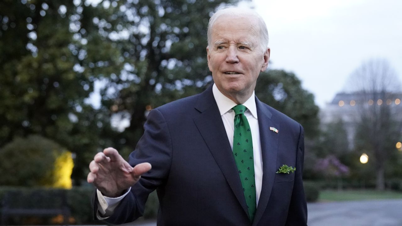 President Joe Biden waves as he walks to Marine One upon departure from the South Lawn of the White House, March 17, 2023, in Washington. 