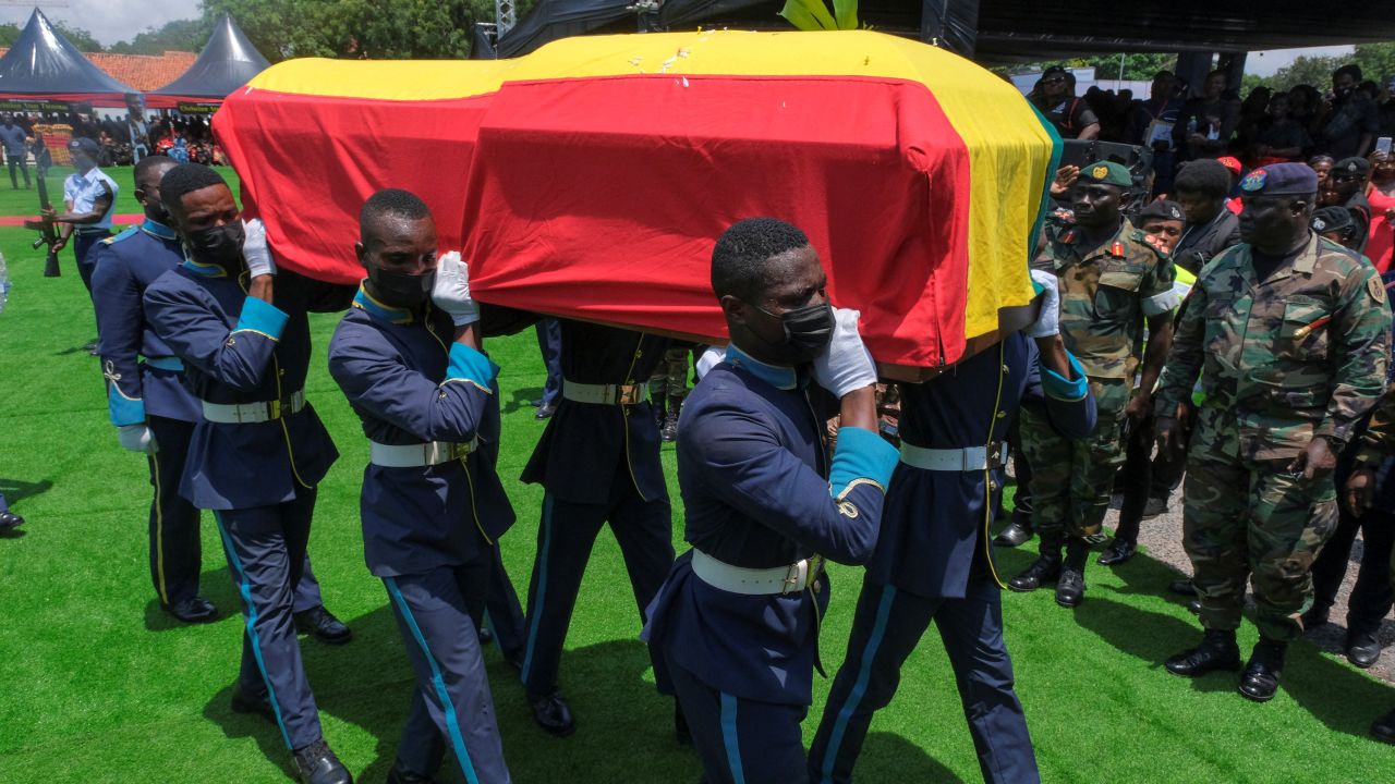 Pallbearers carry the coffin of the late Ghanaian footballer Christian Atsu.