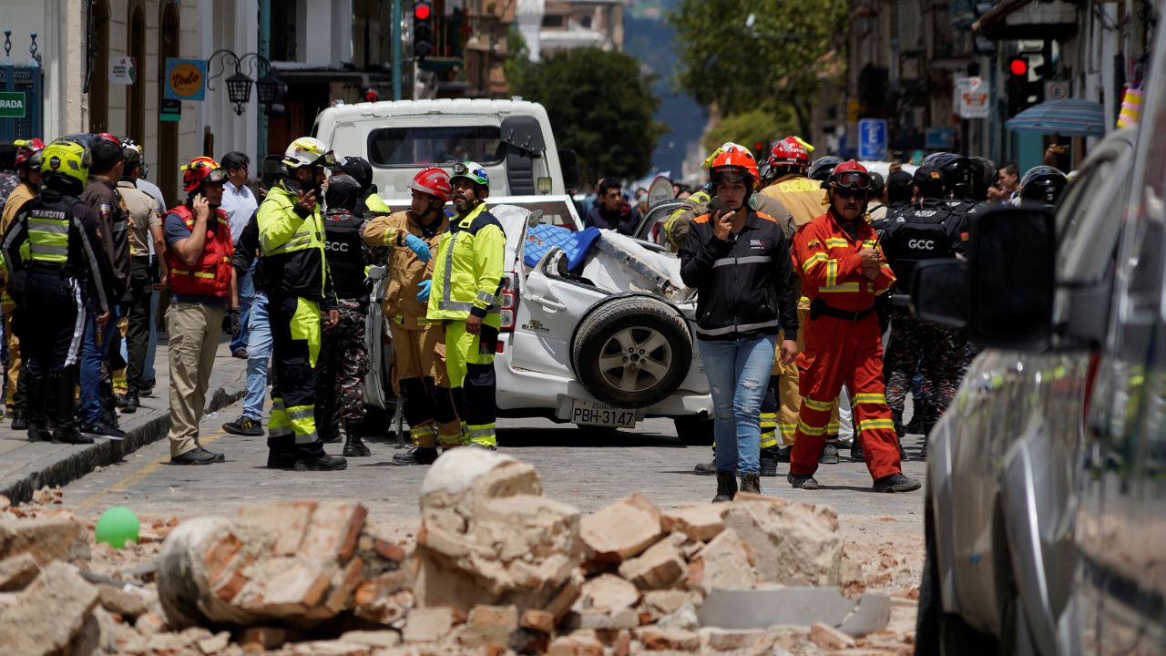 A damaged car and rubble from a house affected by the earthquake are pictured in Cuenca, Ecuador, on March 18, 2023.